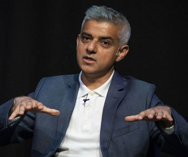 london mayor sadiq khan gestures with his hands as he is being interviewed