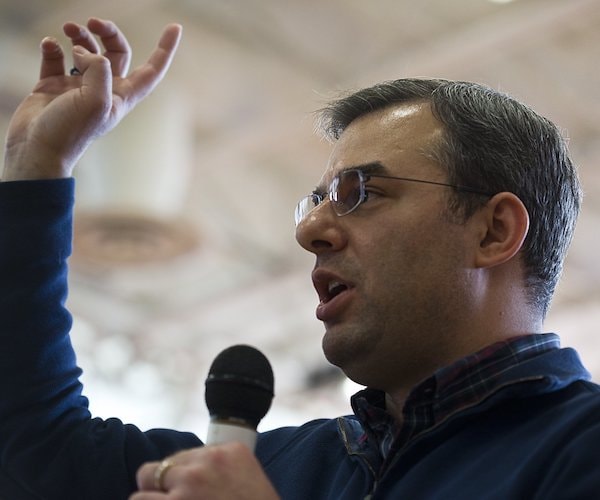 justin amash speaks to a small campaign rally