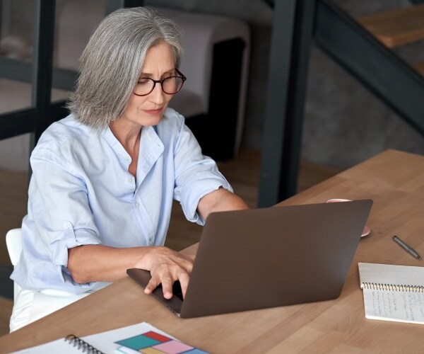 older woman on laptop