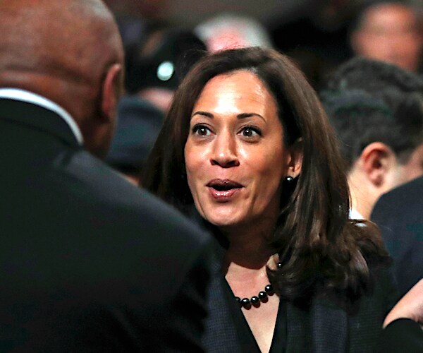 Ex-San Francisco Mayor Willie Brown (left) greets former girlfriend Kamala Harris