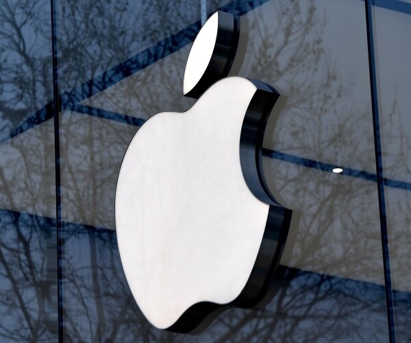 The logo of Apple on display on the facade of an Apple store in Brussels.