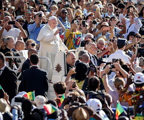 pope francis waves to an excited crowd at the vatican in italy