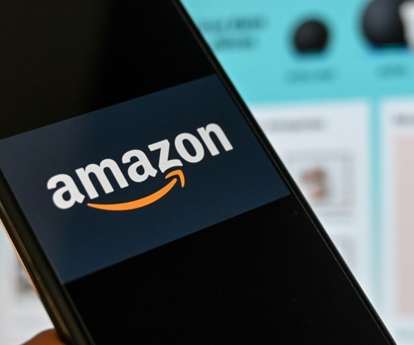 amazon logo is shown on a smart phone 