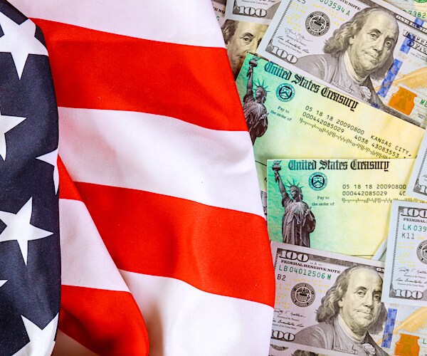 american flag and treasury checks and american dollars