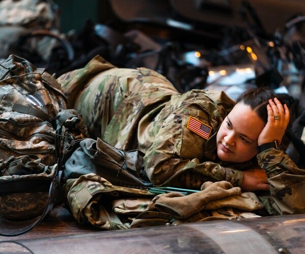 A member of the National Guard takes her break together with her unit at the U.S. Capitol Visitor Center