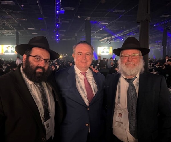 rabbi boruch wolf, chris ruddy, and rabbi liron ederi facing forward