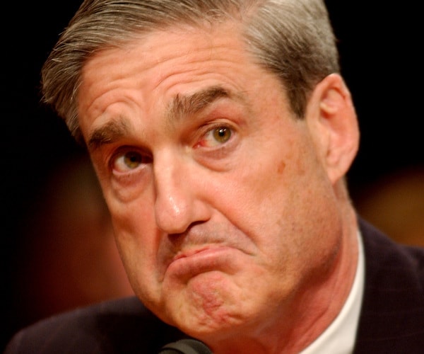 robert mueller frowns during a congressional hearing