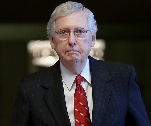 sen. mitch mcconnell walks to a vote.