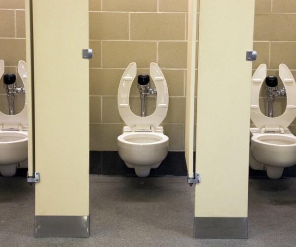 three toilets in public restroom