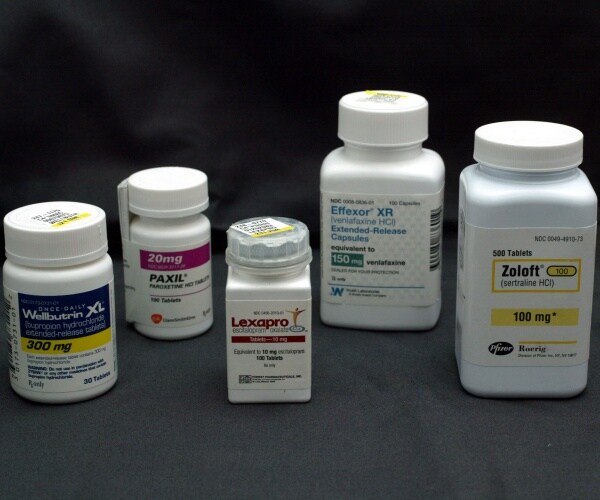 bottles of antidepressant and anti-anxiety medications Wellbutrin, Paxil, Lexapro, Effexor, and Zoloft