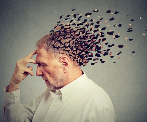 man's head losing parts of head signifying loss of memory/dementia