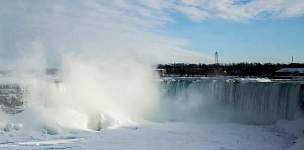 Niagara Falls, Frozen Partially, Draws Visitors to Icy Scene