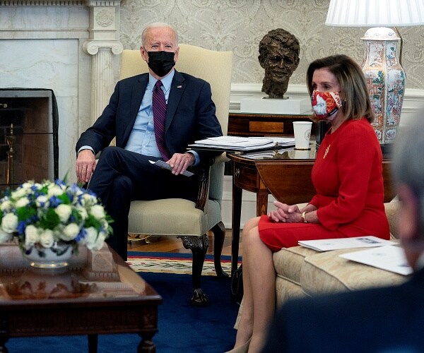 joe biden and nancy pelosi sit in oval office