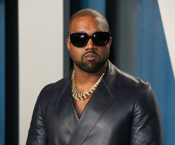 kanye west poses for picture