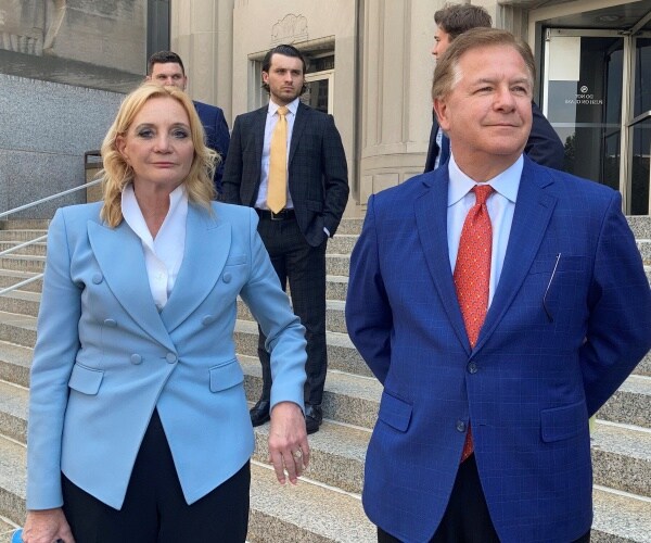 Patricia McCloskey and her husband Mark McCloskey leave a court