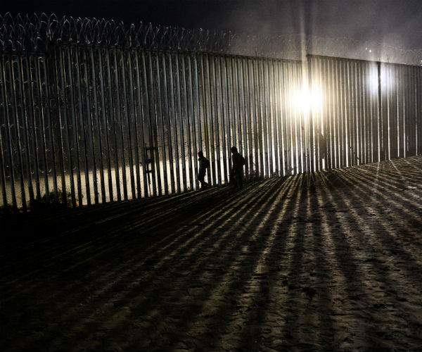 border wall is shown at night