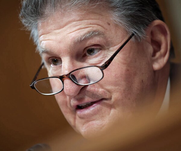 sen joe manchin of west virginia poses a question at a hearing in washington