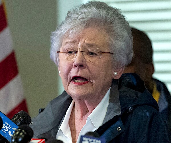 kay ivey speaks to the media during a news conference