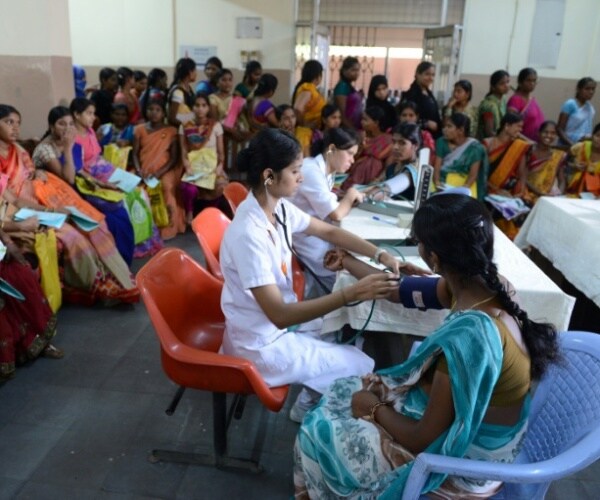 women waiting in a crowded health clinic