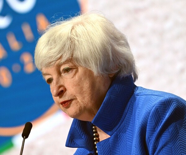 janey yellen speaks into mic