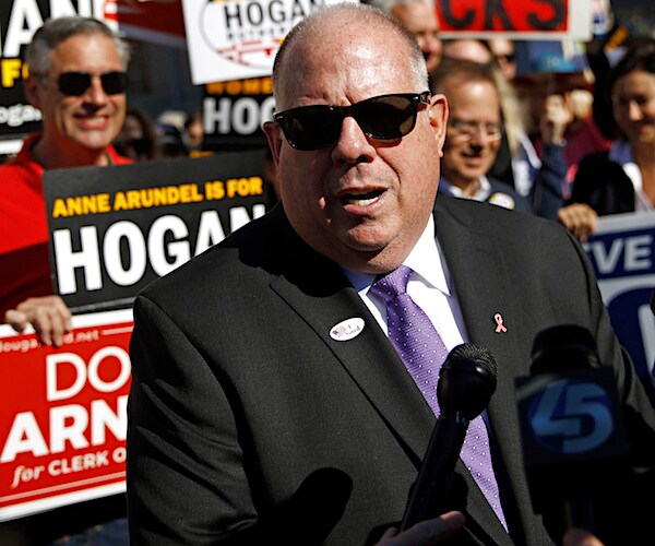 maryland incumbent governor larry hogan delivers a speech with black sunglasses on