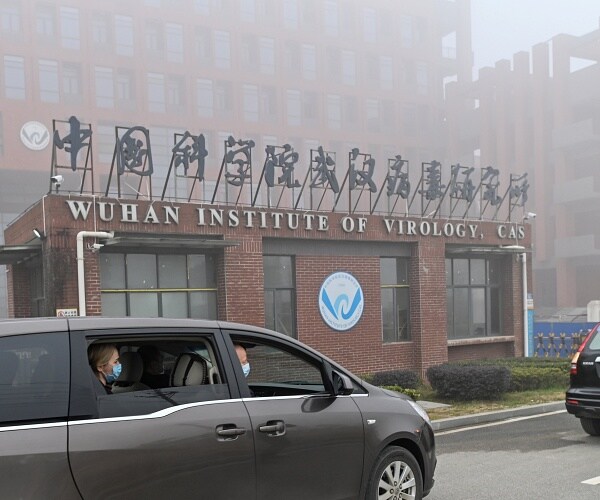 scientists in car outside wuhan lab