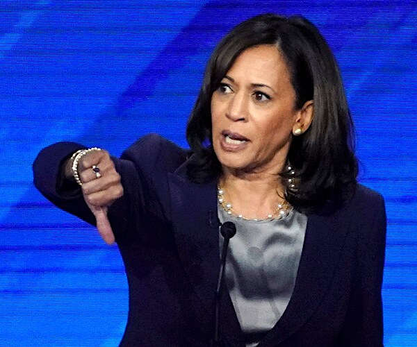 kamala harris gives the thumbs down during a democratic presidential primary debate