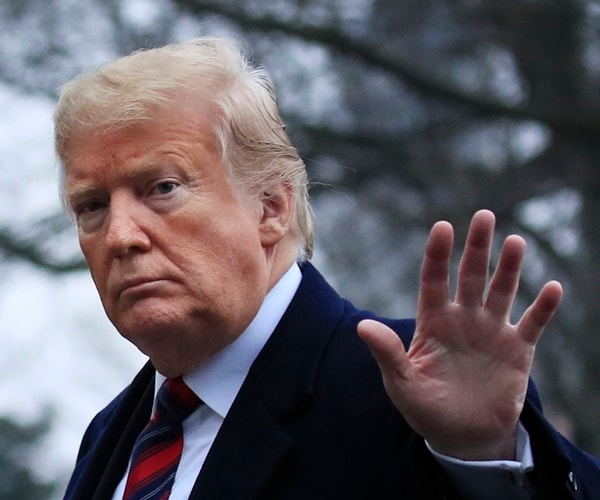 president donald trump waves to media