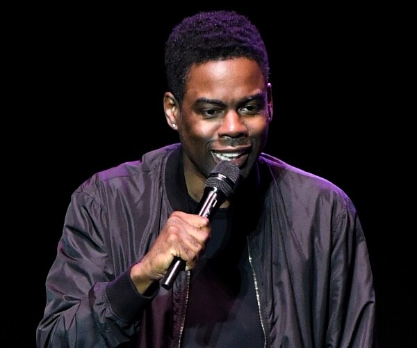 chris rock performs onstage