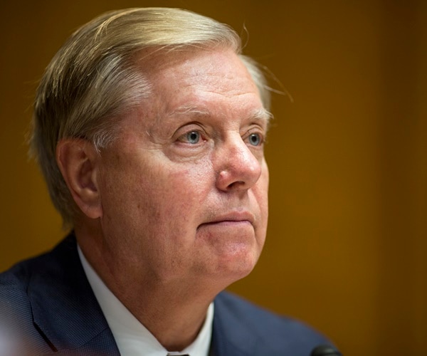 sen. lindsay graham listends during a comittee meeting