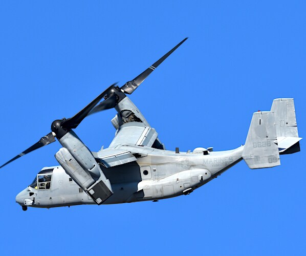 a v-22 osprey flies in the air