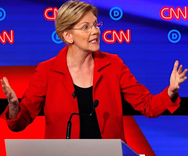 elizabeth warren gestures and speaks during the democratic presidential primary debate