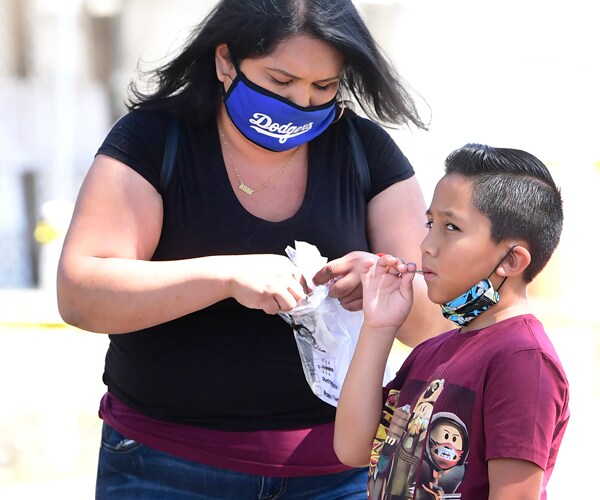 a young boy at a coronavirus test site in california