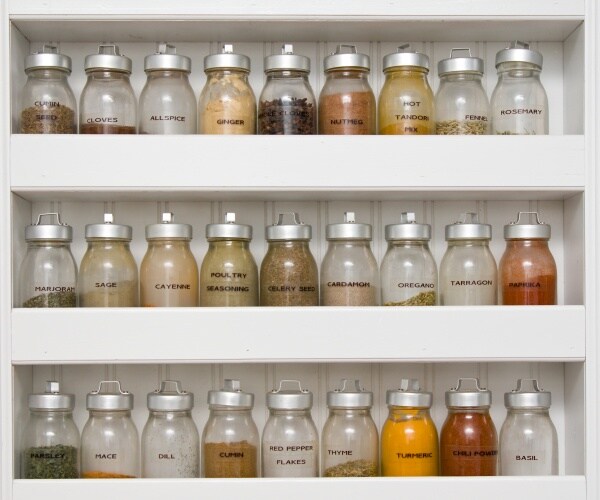 spice rack filled with a variety of spice containers