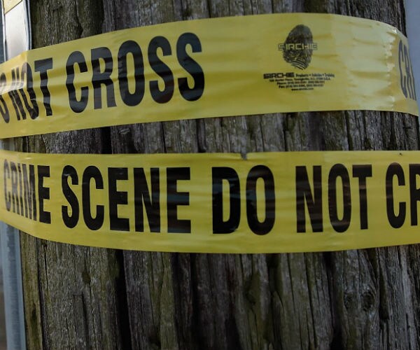 crime scene tape on a post