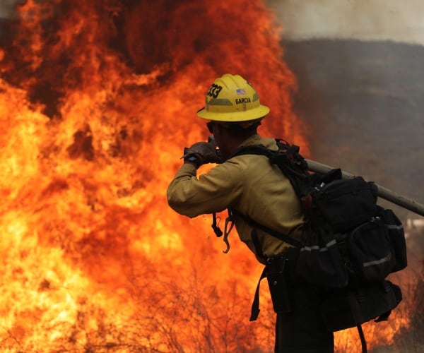 firefighter fighting a wildfire in california