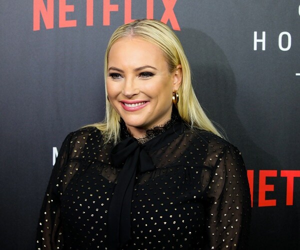 meghan mccain stands on red carpet