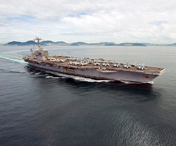 The uss george washington departs from busan south korea in 2010