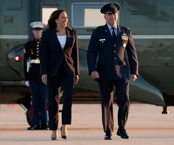 kamala harris walks across tarmac