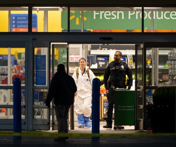 law enforcement near the outside door of the walmart