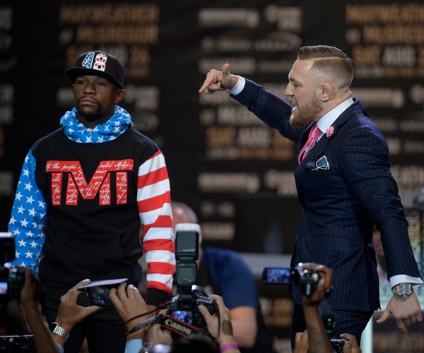 Mayweather vs. McGregor Simmers in Eclipse Shadow