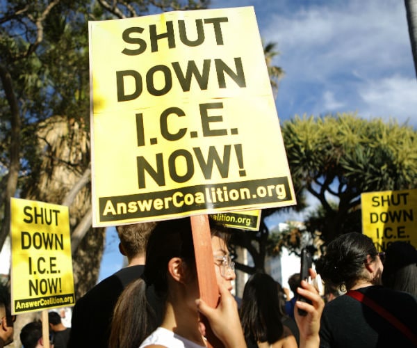 people carrying protest signs