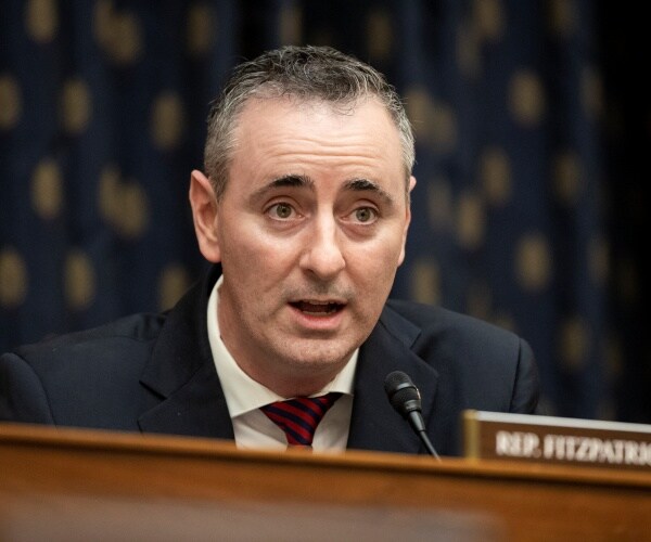 brian fitzpatrick speaks while seated during a hearing.