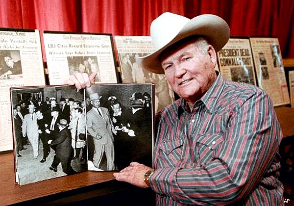 Cop Cuffed to Oswald in Iconic Shooting Photo Is Commended