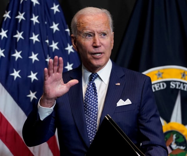 President Joe Biden speaking during a visits to the Office of the Director of National Intelligence