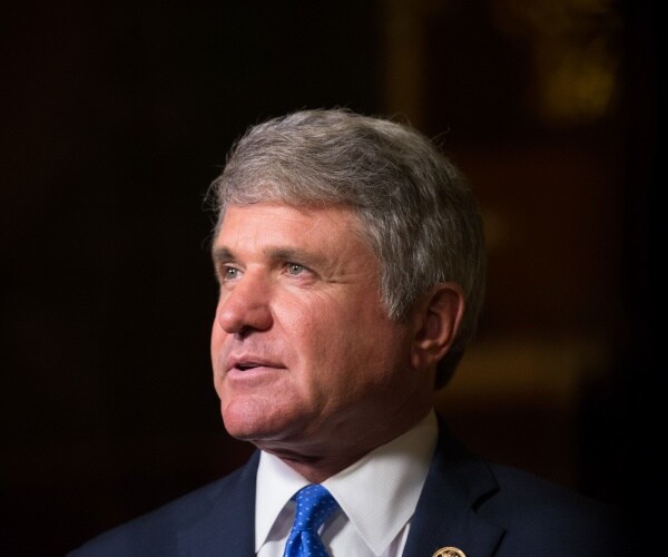 michael mccaul in a suit and bright blue tie and white shirt