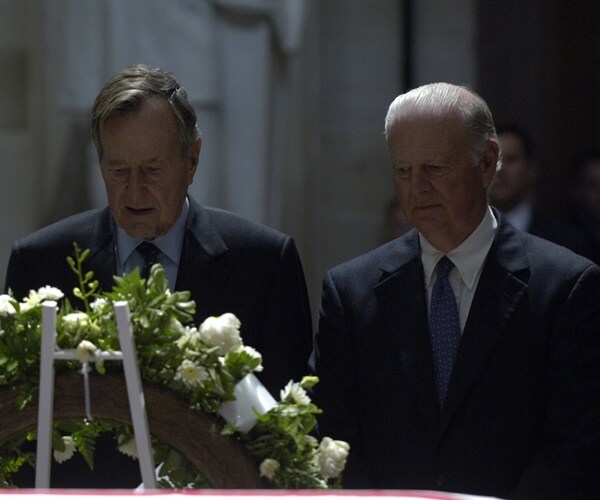 george h.w. bush and james baker pay respects