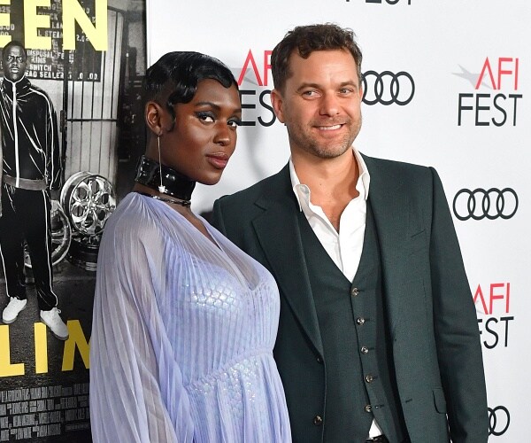 jodie turner smith and joshua jackson stand on red carpet