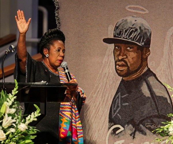 rep. sheila jackson lee speaks at a podium