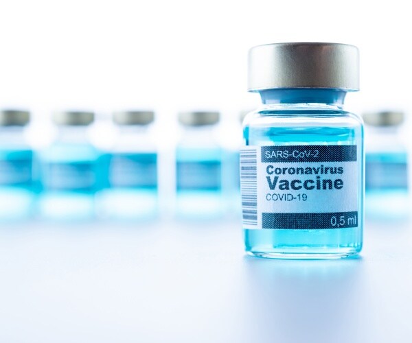 vials labeled "COVID-19 Vaccine"